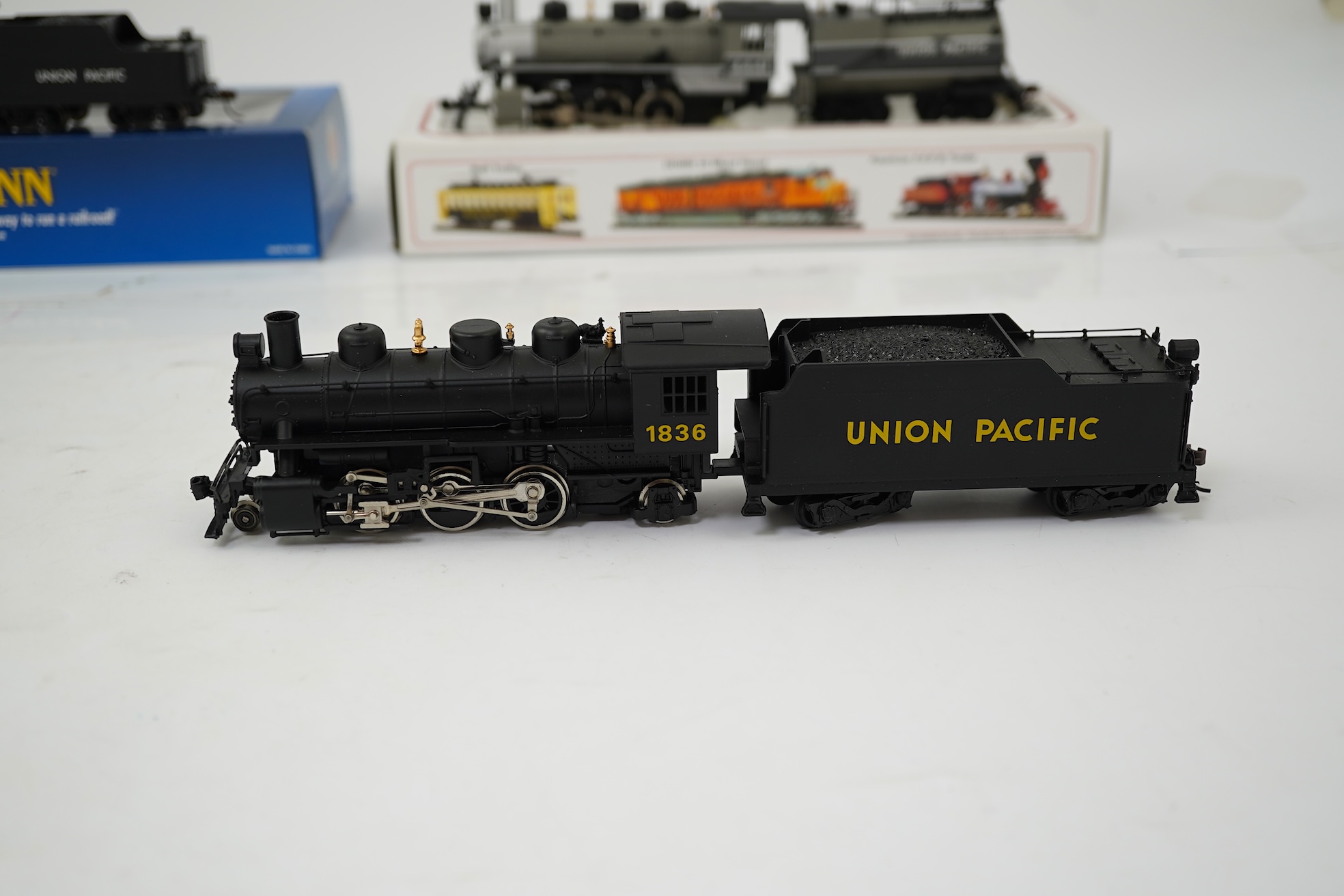 Three boxed HO gauge Bachmann Union Pacific locomotives; (51705) model of ALCO, 41, 2-6-0 locomotive with bogie tender, together with (51501) model of Prairie, 1836, 2-6-2 locomotive with bogie tender, and (50701) model